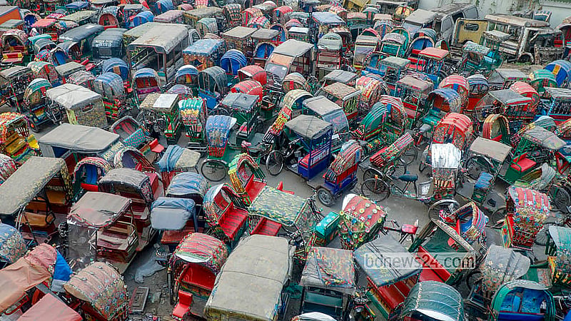 Battery-powered rickshaws seized at different times for traffic violations are piled up at the dumping station near the Postogola Bridge. Photo: Abdullah Al Momin