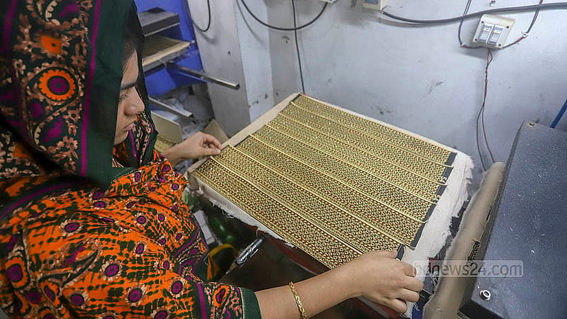 Craftsmen at a skull cap factory in Kamrangirchar are busy ahead of Eid-ul-Fit. Photo: Abdullah al Momin