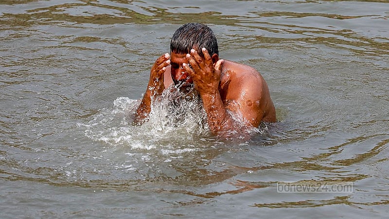 A man bathes in the Turag River in Dhaka’s Gabtoli to escape the summer heat. Photo: Muhammad Mostafigur Rahman