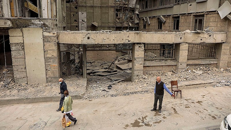 People walk on the street following an Israeli and the U.S. strike on Gandhi Hotel Hospital, amid the U.S.-Israel conflict with Iran, in Tehran, Iran, March 2, 2026. Photo: Reuters