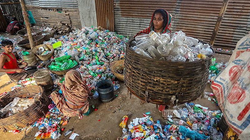 Sacks filled with plastic waste line the outside of a shop in Lalbagh. Photo: Abdullah Al Momin