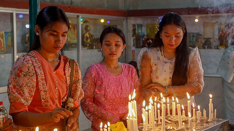 Buddhists celebrate Buddha Purnima or Boishakhi Purnima by lighting candles at the Dharmarajik Buddhist Monastery in Sabujbag on Sunday. Photo: Mahmud Zaman Ovi