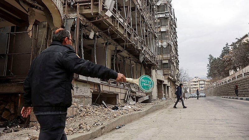 People walk on the street following an Israeli and U.S. strike on Gandhi Hotel Hospital, amid the U.S.-Israel conflict with Iran, in Tehran, Iran, March 2, 2026. Photo: Reuters