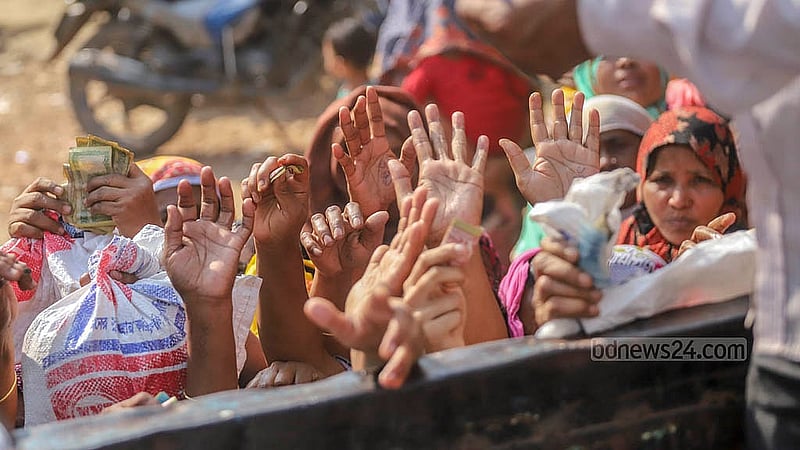 People desperately reach towards a TCB truck selling subsidised goods, hoping to get necessities for cheap before the stock runs out. Photo: Abdullah al Momin