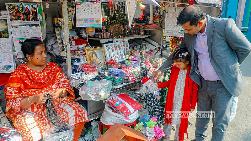 Many buy Christmas decorations from a temporary stall outside the Holy Rosary Church in Tejagon, Dhaka. Photo: Abdullah Al Momin