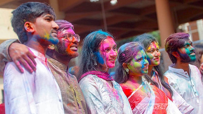 Young women, covered in powdered colours known in Bengali as Abir, celebrate by dancing and singing during the Doljatra at Dhakeshwari Temple on Tuesday, Mar 3, 2026. Photo: Abdullah Al Momin