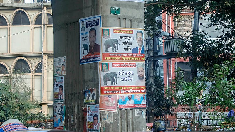 Near Shikkha Bhaban, metro rail pillars display posters of three candidates from the same party. Many other pillars are similarly covered. Photo: Abdullah Al MominNear Shikkha Bhaban, metro rail pillars display posters of three candidates from the same party. Many other pillars are similarly covered. Photo: Abdullah Al Momin