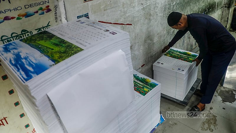 The pages of the calendar are arranged according to the month as workers toil away at a printing press in Dhaka’s Fakirapul. Photo: Abdullah Al Momin