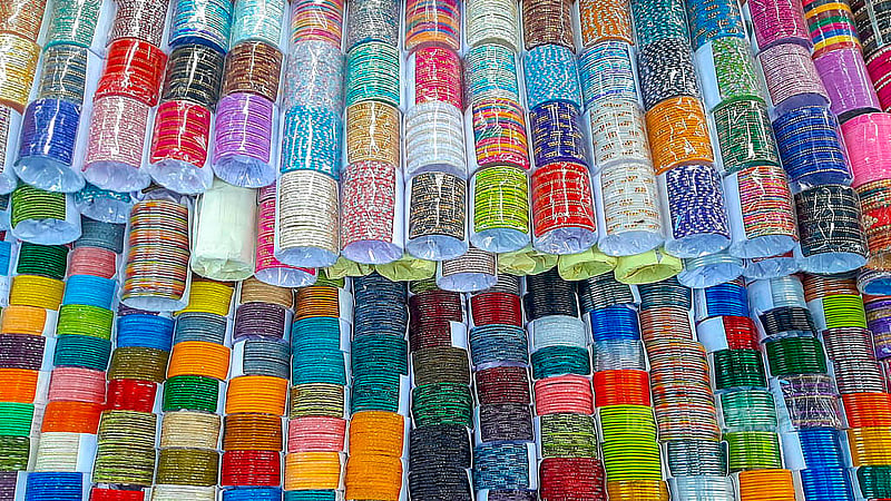 Colourful bangles made in Lalbagh are sold on the sidewalk near Dhaka University. A handful of bangles sell for Tk 30-100 here, depending on the size and design. Photo: Abdullah Al Momin