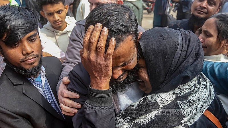 Mohammad Yusuf, arrested in the Pilkhana tragedy, was released on bail in 2013 in the case of the killings but has remained in jail for years for a case filed under the Explosives Act. Following his release on bail on Thursday, Jan 23, 2025, he hugs his family at the gate of the Dhaka Central Jail. Photo: Abdullah al Momin