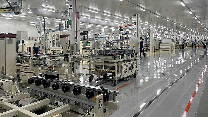 Employees work inside a Toyota Kirloskar Auto Parts factory where the company builds E-Drives for its hybrid cars in Bidadi in the southern state of Karnataka, India, June 26, 2022. REUTERS