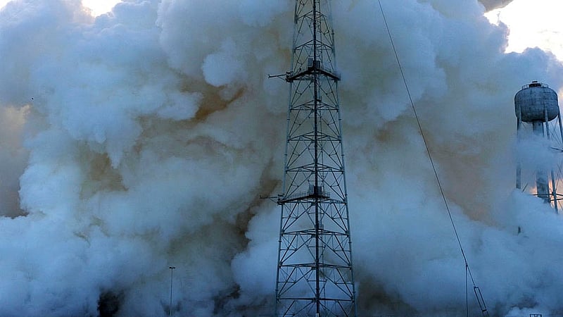 Smoke shrouds a lightning suppression tower after the launch of NASA's Artemis II mission to fly by the moon, at the Kennedy Space Center in Cape Canaveral, Florida, U.S., April 1, 2026. Photo: Reuters