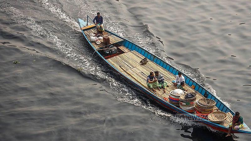 The water of the Buriganga River is inky black with pollution. The boats that cross it leave white foam in their wake, as seen in this photo taken from Babubazar Bridge. Photo: Mahmud Zaman Ovi