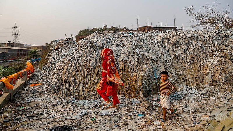 Waste leather has been stacked along both sides of a road near a bone factory in Hazaribagh’s Kalunagar. Photo: Mahmud Zaman Ovi