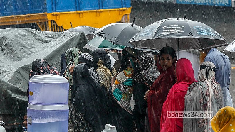 Residents queue in the rain to buy TCB products in Dhaka’s Jatrabari on Monday, May 11, 2026. Photo: Abdullah Al Momin