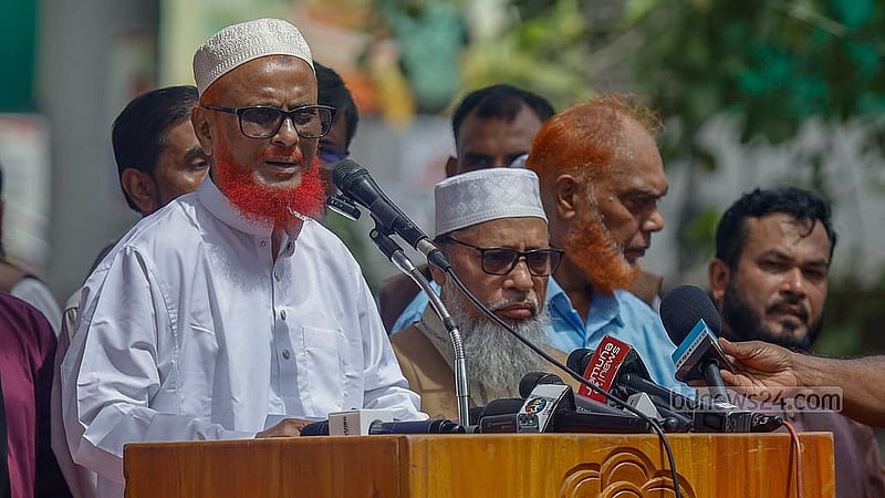 A day after his acquittal from a death sentence in a war crimes case, ATM Azharul Islam joins other Jamaat-e-Islami leaders on stage at a reception event in Dhaka's Shahbagh to mark his release from jail on Wednesday, May 28, 2025. Photo: Mahmud Zaman Ovi