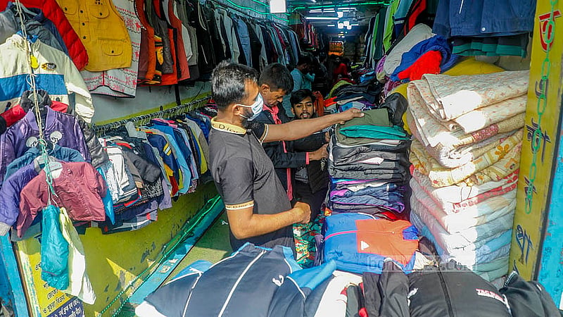 Many people flock to the Sadarghat wholesale market to buy old winter clothes at low prices. Photo: Abdullah Al Momin