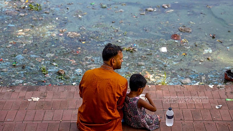 Many visitors are forced to sit near piles of waste after reaching the waterfront. Photo taken at the Begunbari section of Hatirjheel in Tejgaon. Photo: Mahmud Zaman Ovi