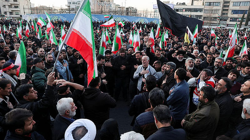 People react as they gather at the Enghelab Square, after Iran's Supreme Leader Ayatollah Ali Khamenei was killed in Israeli and U.S. strikes on Saturday, in Tehran, Iran, March 1, 2026. Photo: Reuters