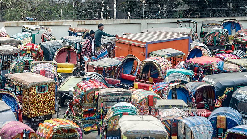 A rickshaw driver searches for his vehicle among the rows of battery-powered rickshaws at the dumping station near the Postogola Bridge. Photo: Abdullah Al Momin