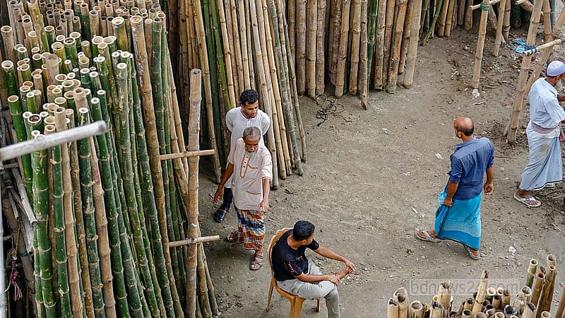 Buyers gather beneath the Sultana Kamal Bridge in Demra, on the Narayanganj side, where the wholesale bamboo market draws customers from several areas.Photo: Mahmud Zaman Ovi