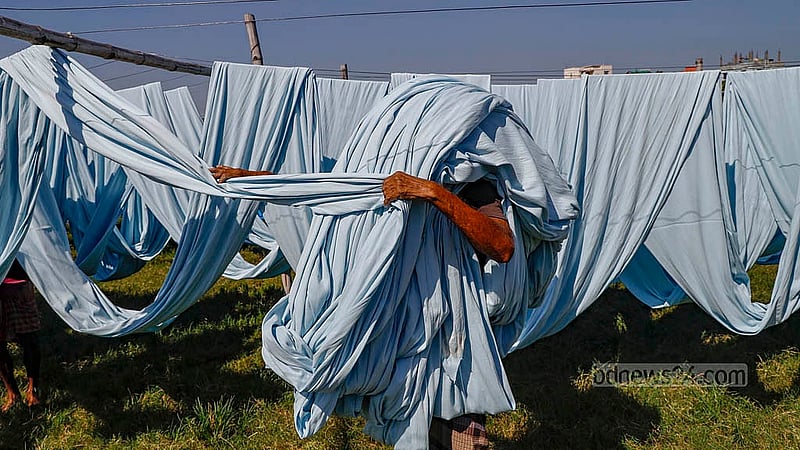 Although advanced machinery is used for dyeing grey fabric, natural sunlight is essential for drying the fabric outdoors. Photo: Mahmud Zaman Ovi