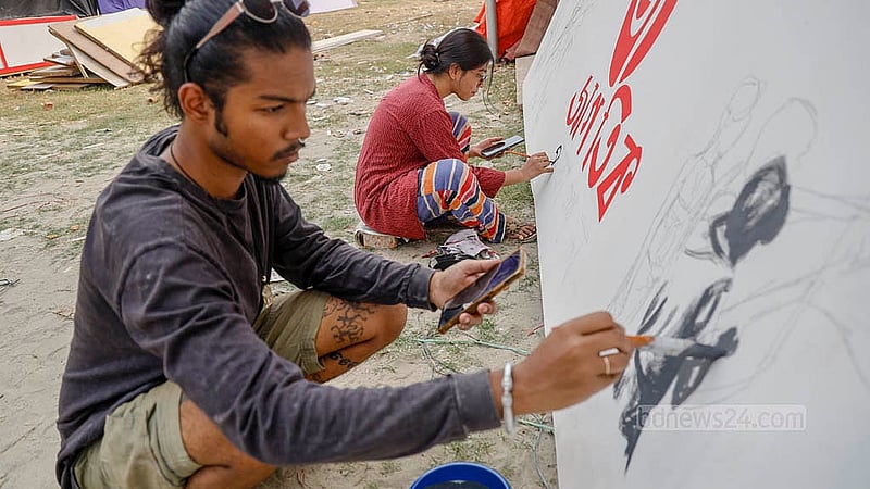 Artists carefully paint the name of a stall at Suhrawardy Udyan, bringing the final visual identity to life before the Amar Ekushey Book Fair opens. Photo: Mahmud Zaman Ovi