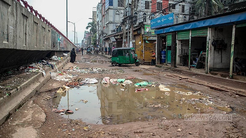 Large vehicles are not using the Dolai Par-Jatrabari road due to the huge potholes, some in the middle of the road. Photo: Abdullah Al Momin