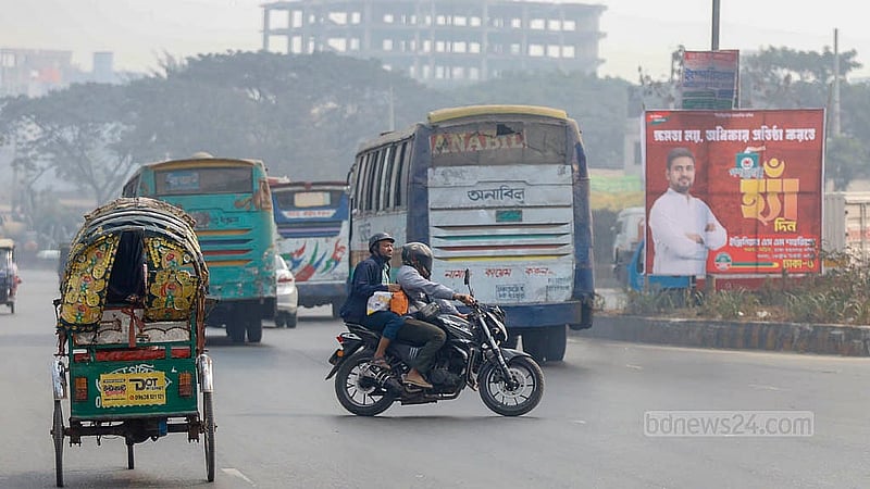 A motorcyclist crosses the highway at Matuail without slowing traffic, navigating between speeding vehicles on the Dhaka–Chattogram highway. Photo: Mahmud Zaman Ovi