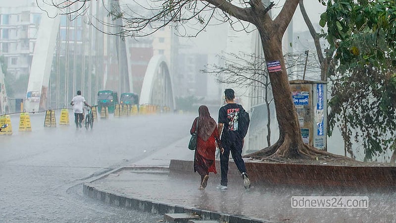 People enjoy the first rain of the season at Hatirjheel, Dhaka, on Monday, Mar 2, 2026. Photo: Abdullah Al Momin