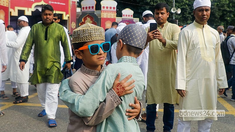 Embraces and greetings are exchanged after the Eid-ul-Azha prayers at the National Eidgah grounds on Thursday, May 28, 2026. Photo: Abdullah Al Momin