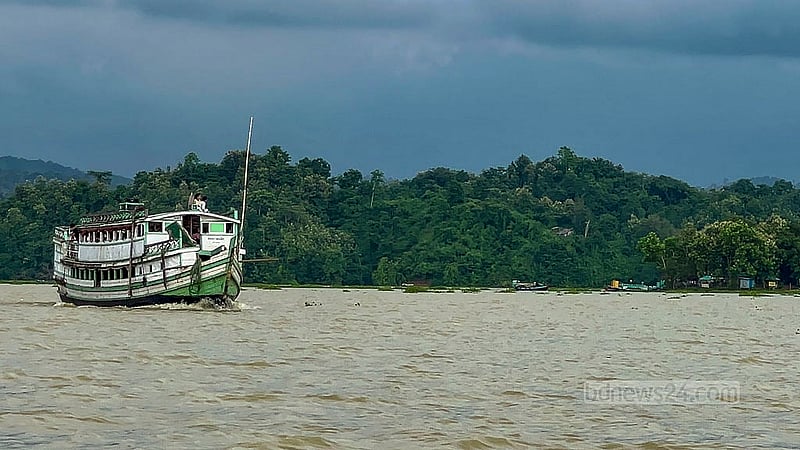 A traditional wooden Rangamati launch makes its way across the surface of Kaptai Lake. The vessel is quite a popular form of transport for those travelling to remote areas of the district. Photo: Samir Mallik
