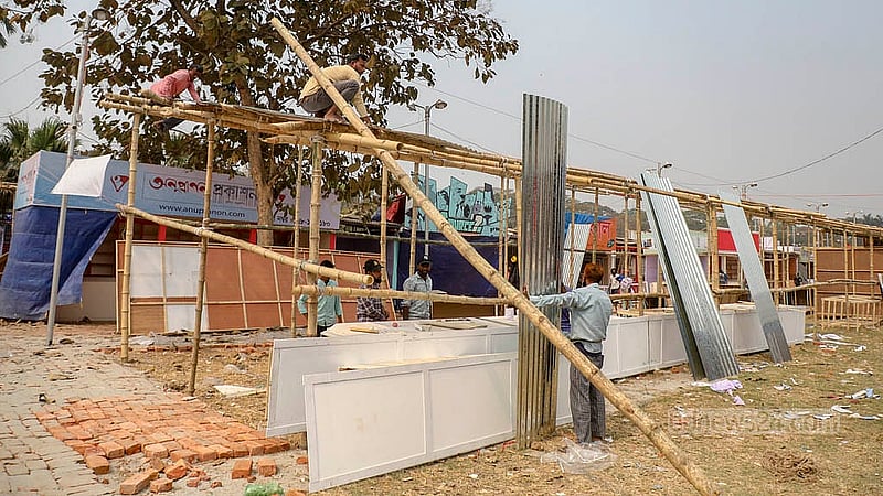 Even at the final hour, carpenters continue building stalls of different sizes at Suhrawardy Udyan as preparations intensify before the Amar Ekushey Book Fair begins. Photo: Mahmud Zaman Ovi