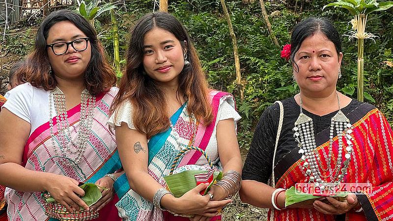 Tripura women in traditional attire on the banks of Khagrachhari's Chengi River on the morning of Hari Boisu. Photo: Samir Mallik