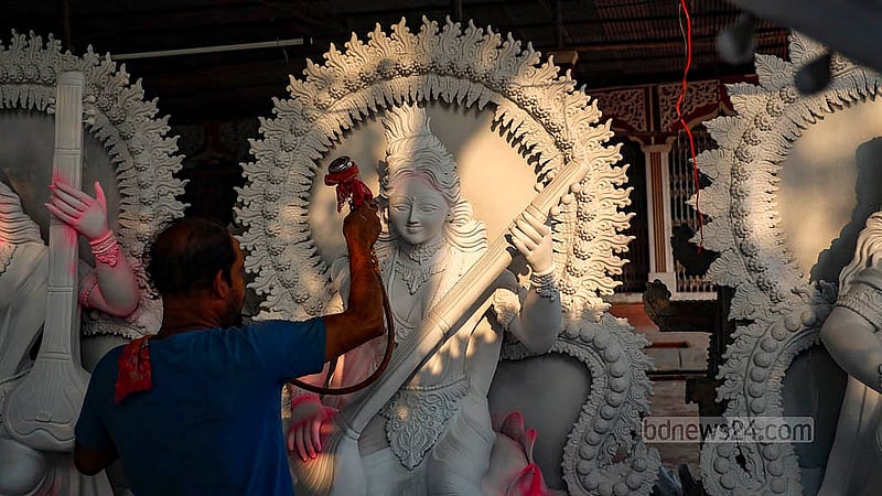 At the Ramna Kali Temple in Dhaka’s Suhrawardy Udyan, artisans apply paint to Saraswati idols, many of which have been commissioned by educational institutions across the city. Photo: Mahmud Zaman Ovi