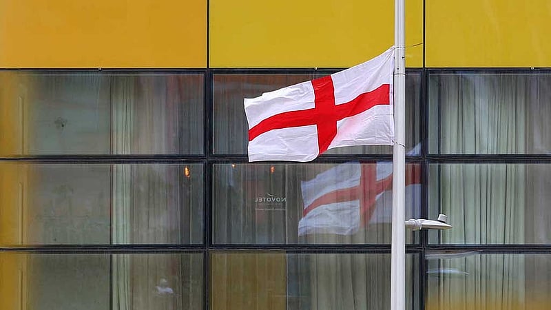 A St George's flag hangs near the Britannia International Hotel in Canary Wharf, which the government reportedly plans to use for asylum accommodation, according to Tower Hamlets Council, in London, Britain, Aug 22, 2025. REUTERS/Isabel Infantes