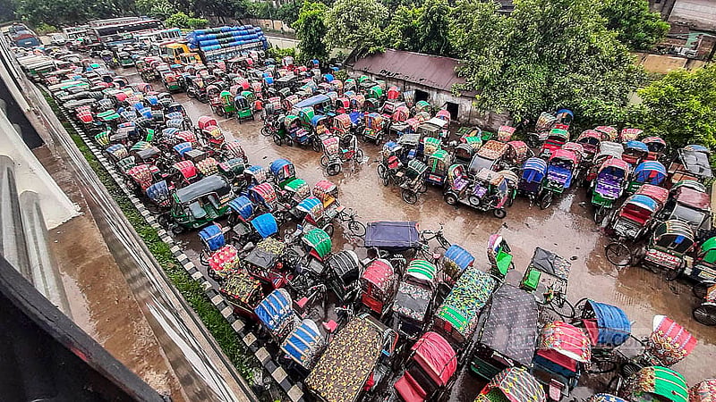Rows of impounded battery-powered rickshaws fill the dumping station on the north side of Dhaka's Postogola Bridge. Photo: Abdullah Al Momin