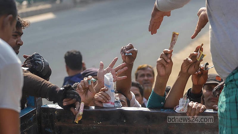 The TCB truck has run out of stock, but customers keep reaching for it in the desperate hope of buying necessities at a subsidised price. Photo: Abdullah al Momin
