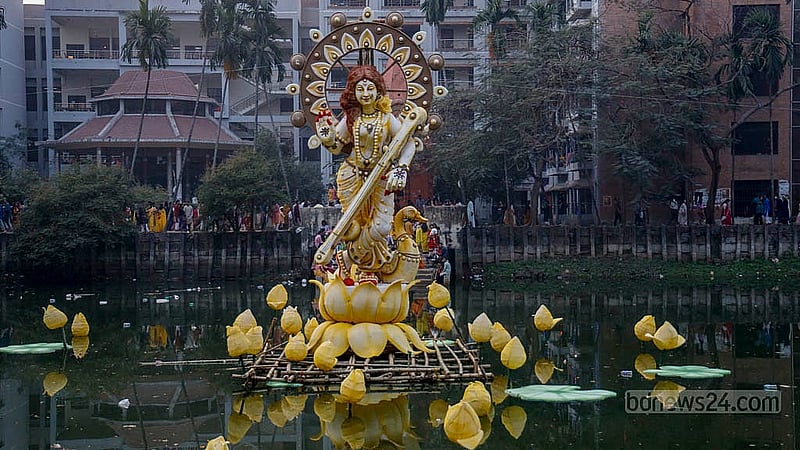 Bidya Debi, the Goddess of Knowledge and another name for Goddess Saraswati, is worshipped at the pond of Jagannath Hall, Dhaka University, on Friday, Jan 23, 2026, during Saraswati Puja. Photo: Mahmud Zaman Ovi