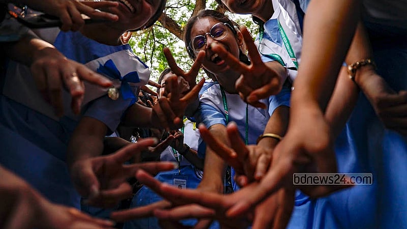 Students of Viqarunnisa Noon School and College show the ‘V’ sign as they celebrate SSC results on Sunday, May 12, 2024.