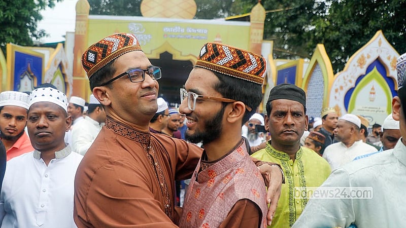 Devotees embrace after the Eid-ul-Fitr prayers at the National Eidgah on Saturday morning. Photo: Abdullah al Momin