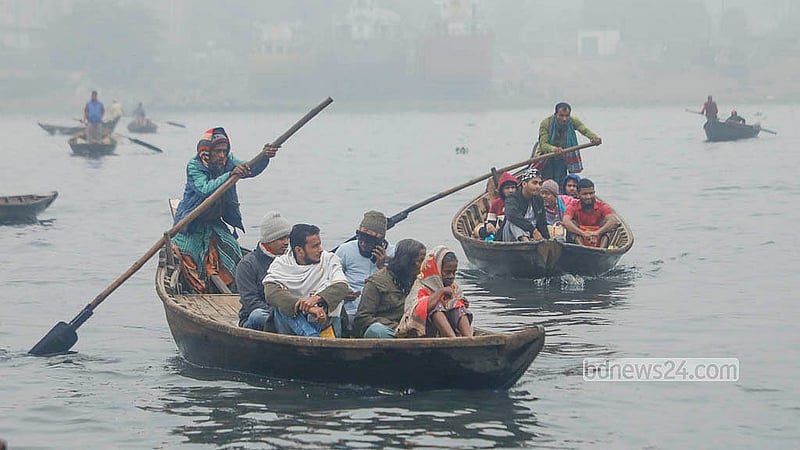 In Sadarghat, shivering commuters cross the river by boat on a cold winter morning. Photo: Abdullah al Momin