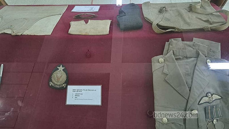 Bir Shreshthho Matiur Rahman's Air Force badge, uniform, and pen.