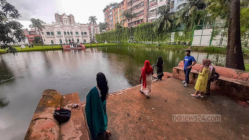 A pond sits before the main building of the Rose Garden, where visitors often linger along its banks. Photo: Abdullah Al Momin