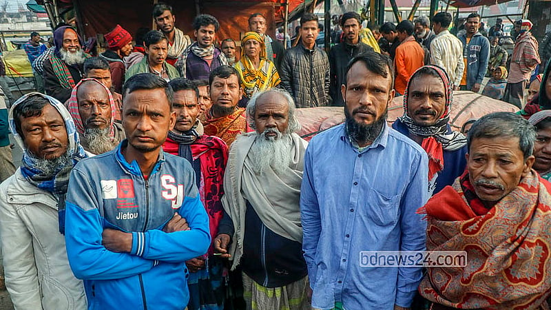 Both men and women wait for work at the Hemayetpur bus terminal area in Savar. Depending on the type of work, women labourers earn between Tk 400 and Tk 600 a day, while male workers earn between Tk 600 and Tk 1,000. Photo: Abdullah Al Momin