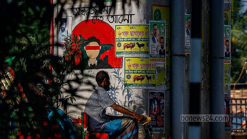 A piece of graffiti on the Kalshi Flyover pillar had been painted based on a line from Rabindranath Tagore’s song “Andhojone Deho Alo” (Give light to the blind). But that too is being covered up by posters. Photo: Mahmud Zaman Ovi