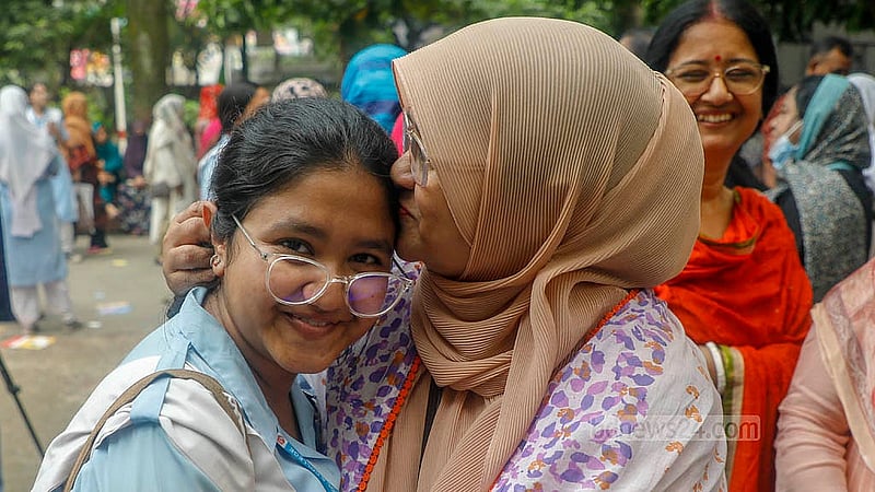 A mother embraces her daughter Payel, a VNSC student from the science stream, after she secured a GPA-5. Photo: Abdullah Al Momin