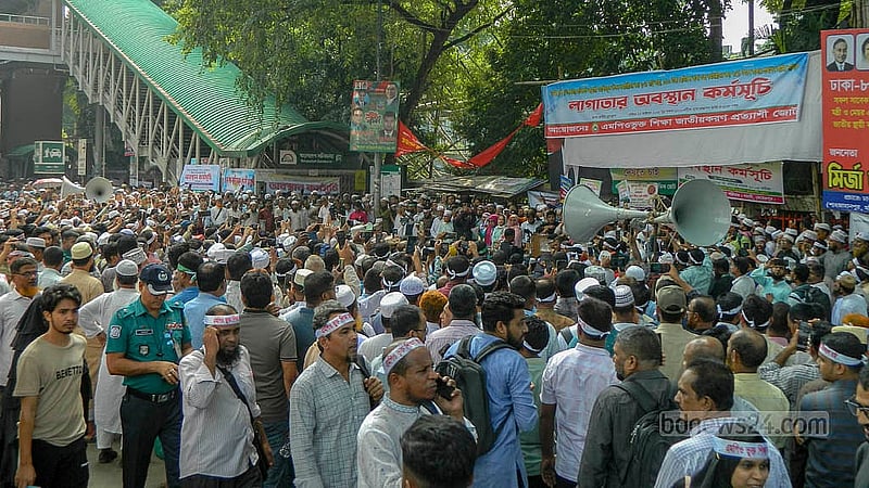 MPO-listed teachers and employees began a continuous sit-in in front of the National Press Club on Sunday, Oct 12, 2025, pressing for their house rent allowance to be raised to 20 percent of the basic salary, medical allowance to Tk 1,500, and festival bonus for staff to 75 percent.
