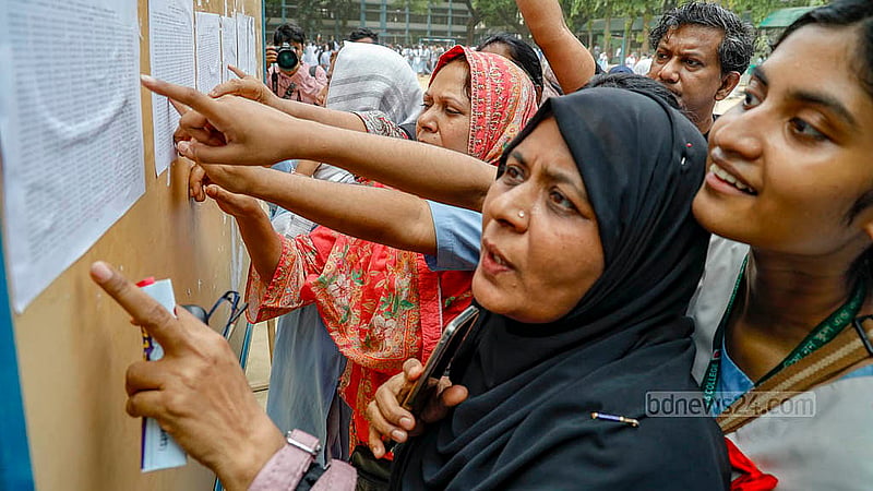 A parent checks SSC results on the notice board on Sunday, May 12, 2024.