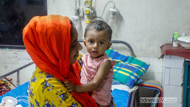 Aiyan, a child identified by a single name, has been admitted to the Infectious Diseases Hospital in Dhaka's Mohakhali after being brought from Tongi with measles. Photo: Abdullah al Momin